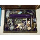 An Edwardian jewellery box with a small collection of silver and other jewellery, various wrist