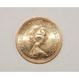 An Elizabeth II 1976 gold sovereign.