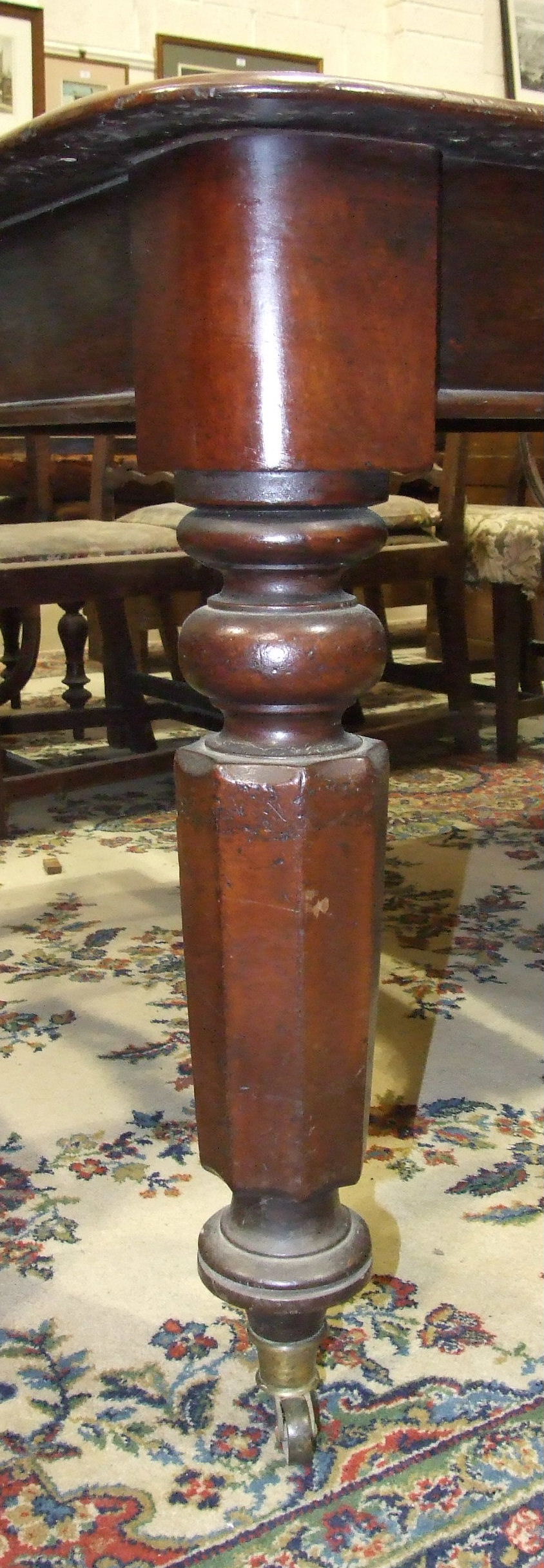 A 19th century mahogany pull-out dining table, the top with three spare leaves, on octagonal and - Image 2 of 2