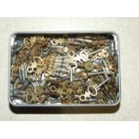 A collection of approximately eighty-five various vintage and modern pocket watch keys.