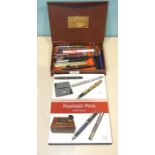 A collection of fifteen modern fountain pens and a book 'Fountain Pens' by Peter Twydle.