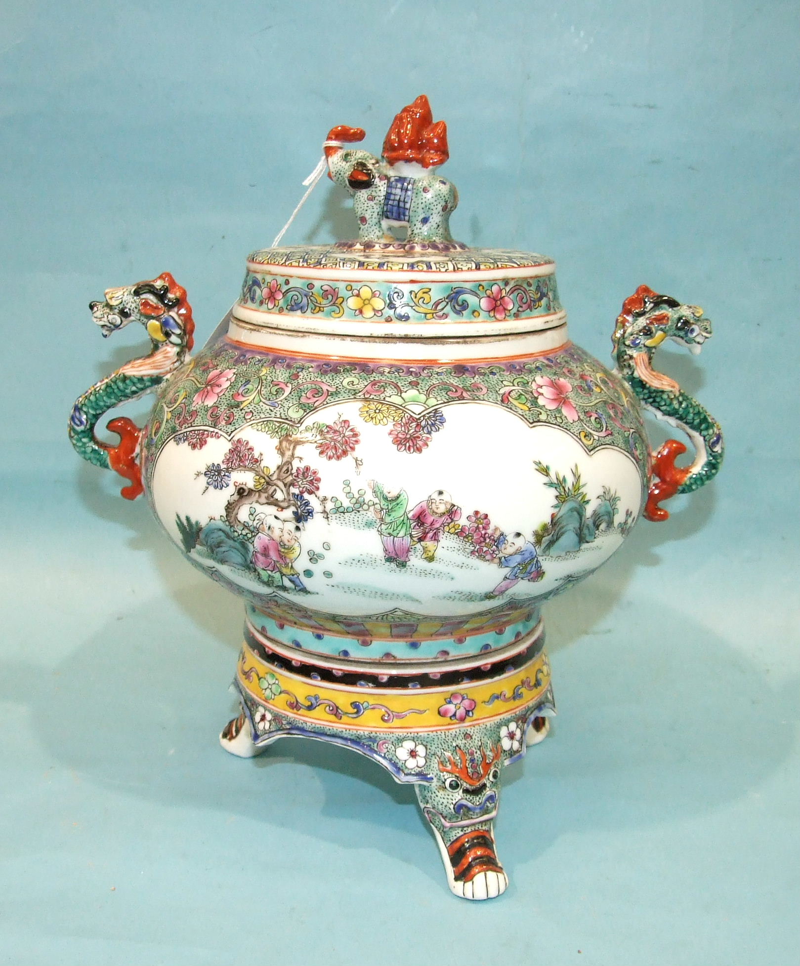 A large famille-rose-style jar, cover and stand, decorated with children in a garden, seal mark in