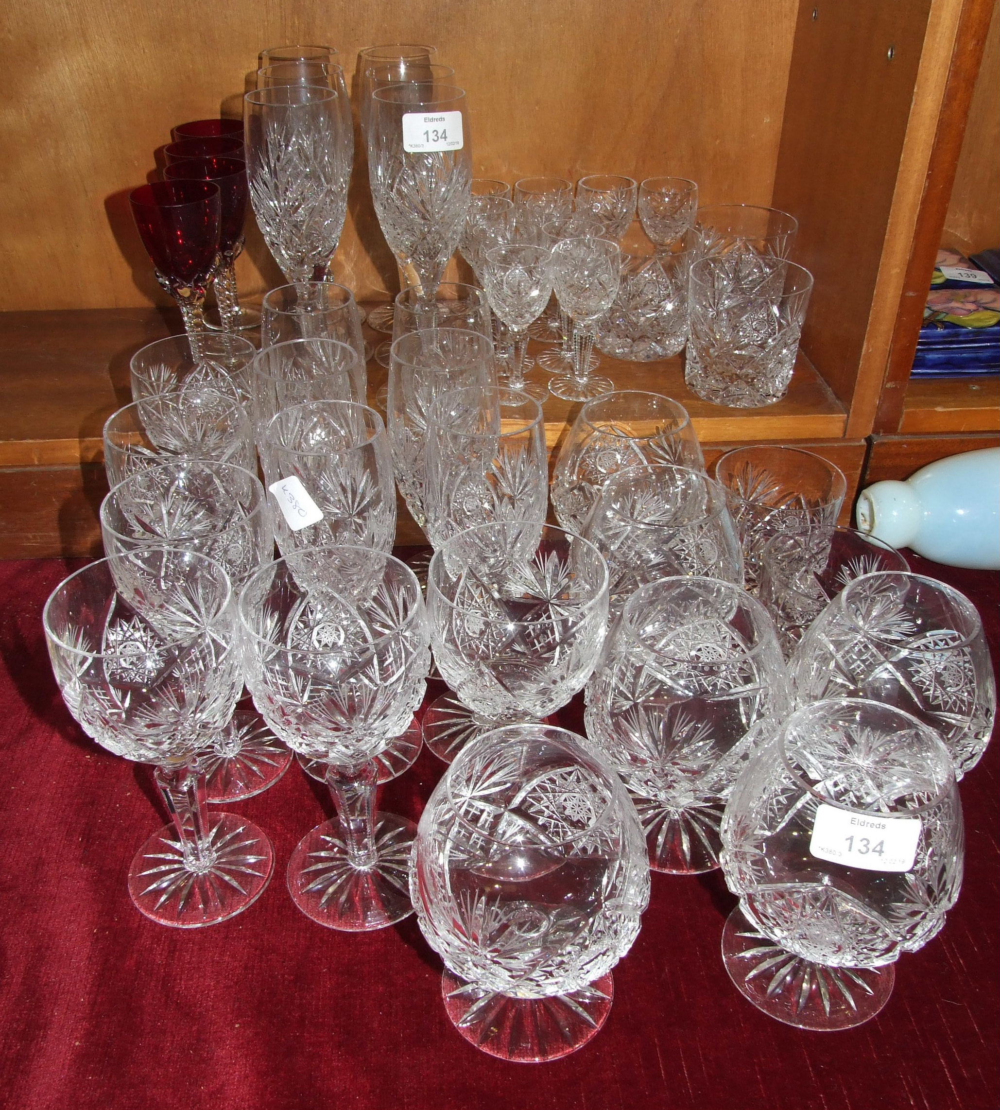 A part-suite of cut-glass drinking glasses.