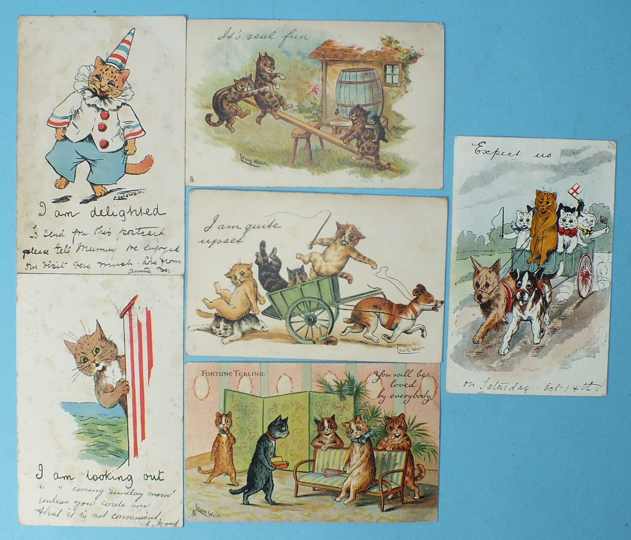 Six Louis Wain postcards: "I am looking out", "I am delighted", "I am quite myself", "It's real