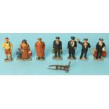 Seven Timpo railway figures, to include woman with child, man with rucksack, man in brown coat and