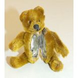 Schuco, a miniature teddy bear compact, with lipstick, gold mohair plush, 9cm.