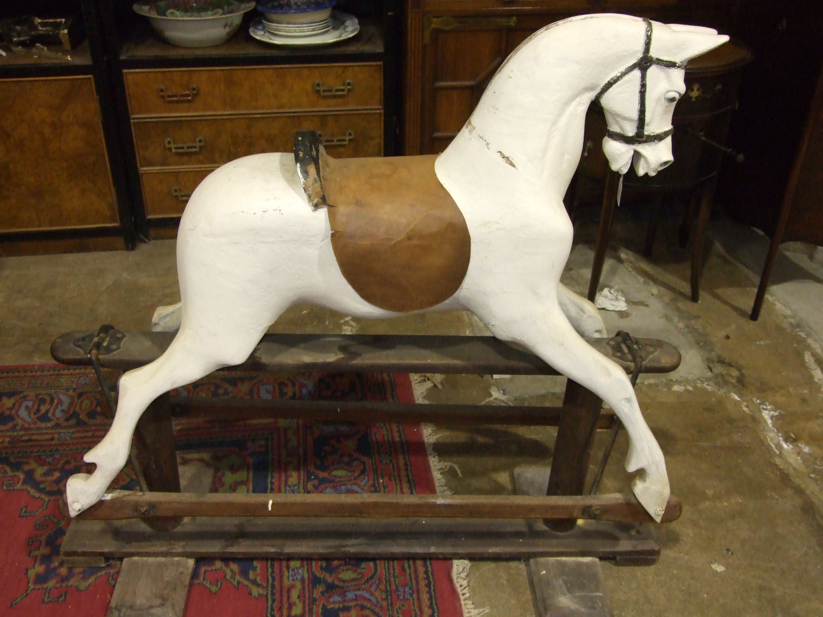 An early-20th century rocking horse on pine trestle, (a/f, re-painted, no mane or tail), 110cm high, - Image 2 of 4