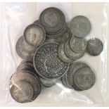 A collection of British and foreign coinage, including pre-1946 silver.