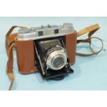 An Agfa Super Isolette folding camera, numbered UK4137 with Solinar 1:3.5/75 lens no. U07069, in