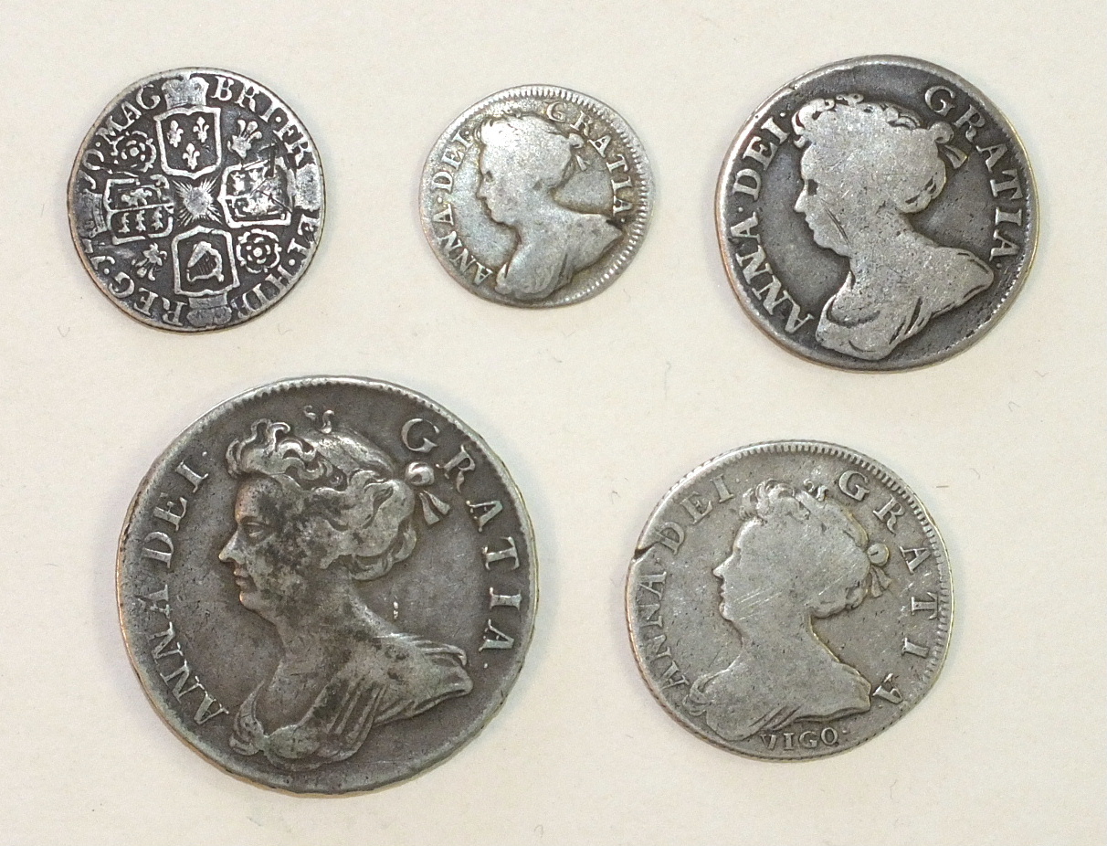 Five Queen Anne silver coins: half-crown 1709 (Octavo), shilling 1703, 1711, sixpence 1710 and