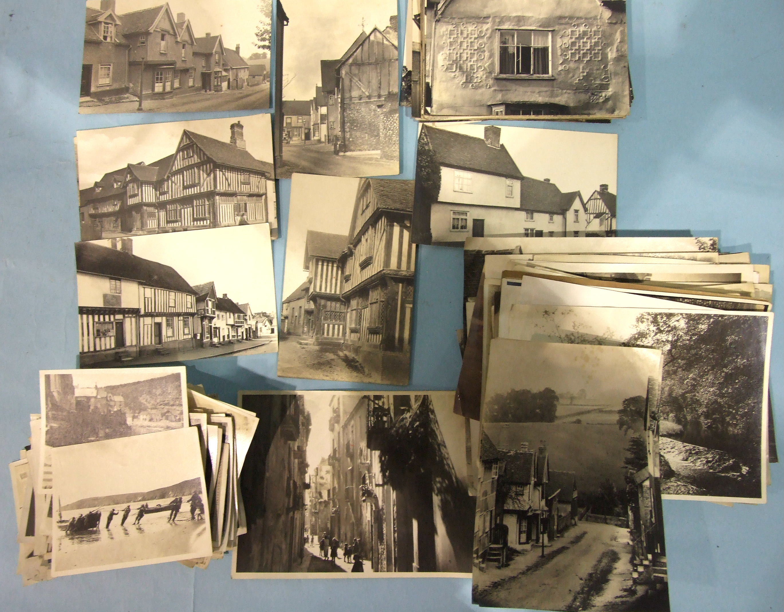 Thirty-four RP postcards of Lavenham by F L Ranson and a quantity of photographs, UK and foreign,