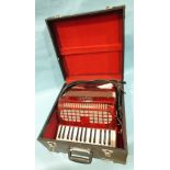 A Chanson 48-bass accordion, in case.