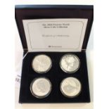 A Westminster Mint 2004 Famous World silver coin collection consisting of four 1 Troy ounce coins: