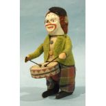 Schuco, a clockwork clown drummer, with clothed tinplate body, (working, no key).