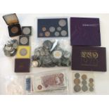 A collection of various British coinage, including 1920-1946 silver, two Series C £1 notes, (