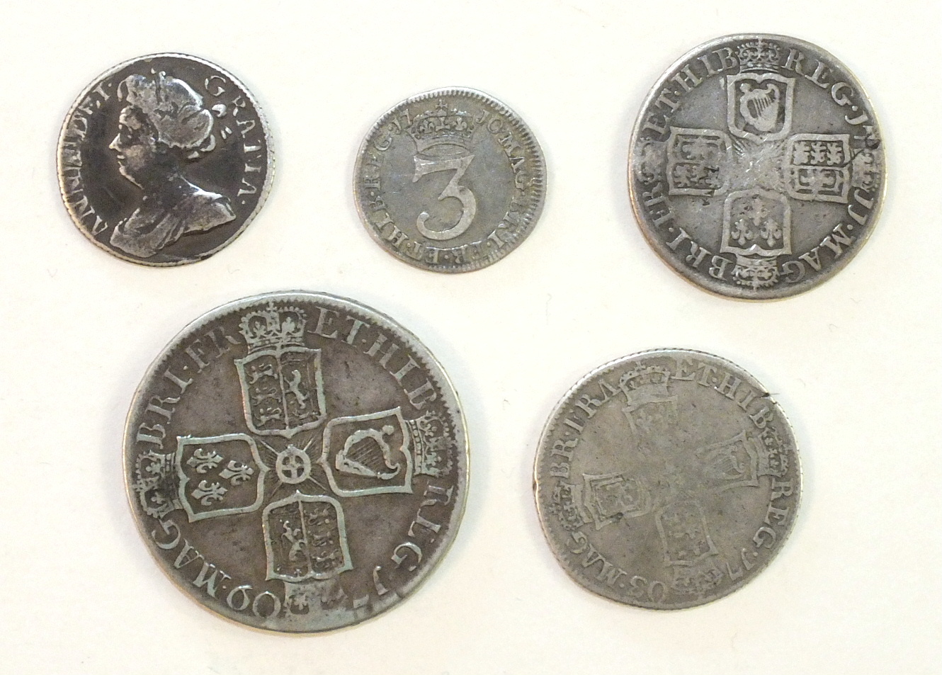 Five Queen Anne silver coins: half-crown 1709 (Octavo), shilling 1703, 1711, sixpence 1710 and - Image 2 of 2