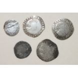 A Charles I hammered silver shilling and a sixpence (mis-strike), two James I shillings and a