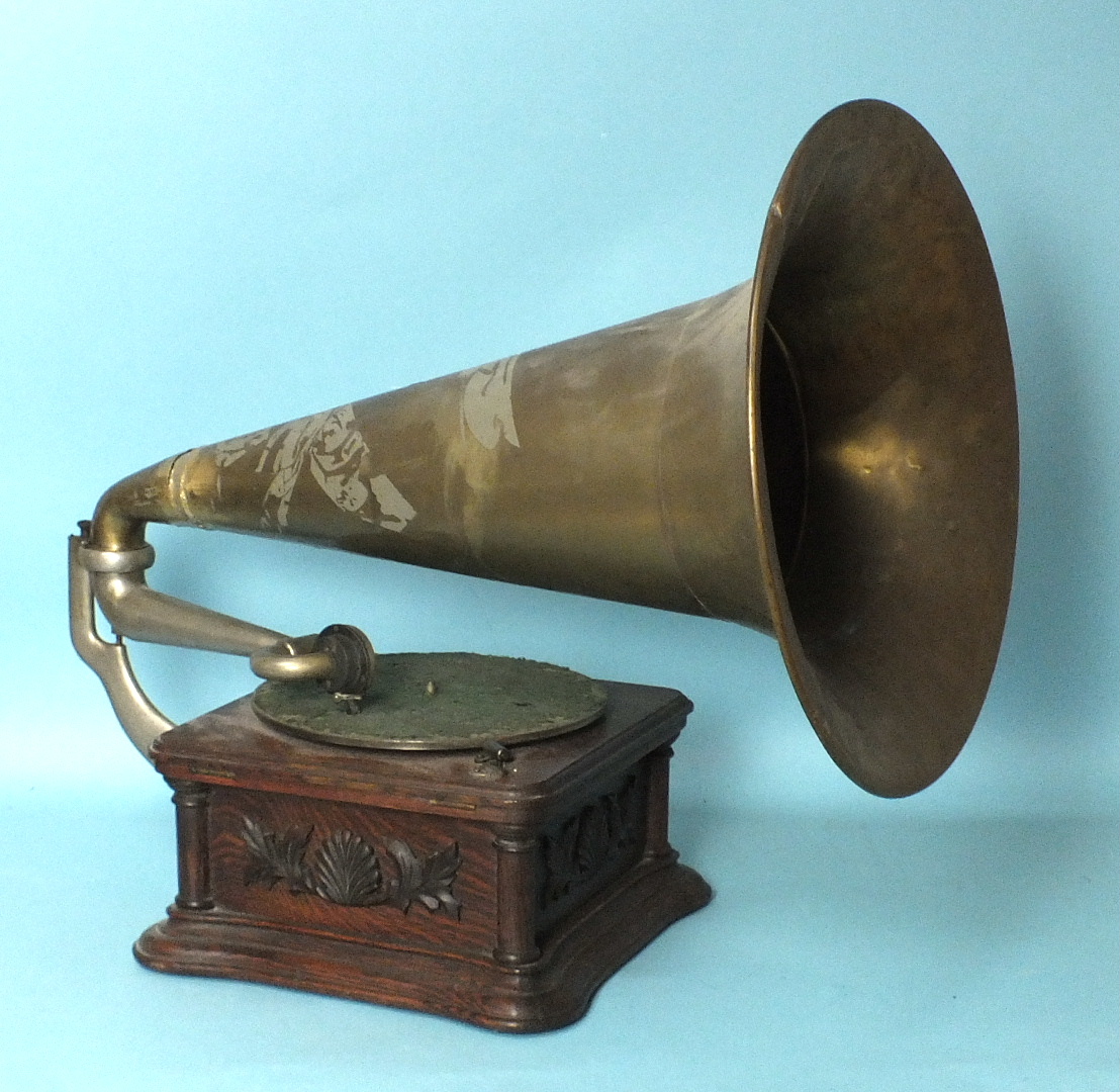 A "Cockleshell" Monarch gramophone by Gramophone & Typewriter Ltd, c1908, with brass horn, gold