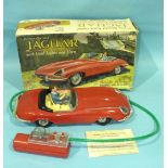 Marx Toys, a battery operated remote controlled Jaguar with head lights and horn, boxed.