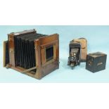 A 19th century full-plate studio camera, (no lens), an Agfa folding camera and a Box Brownie, (3).