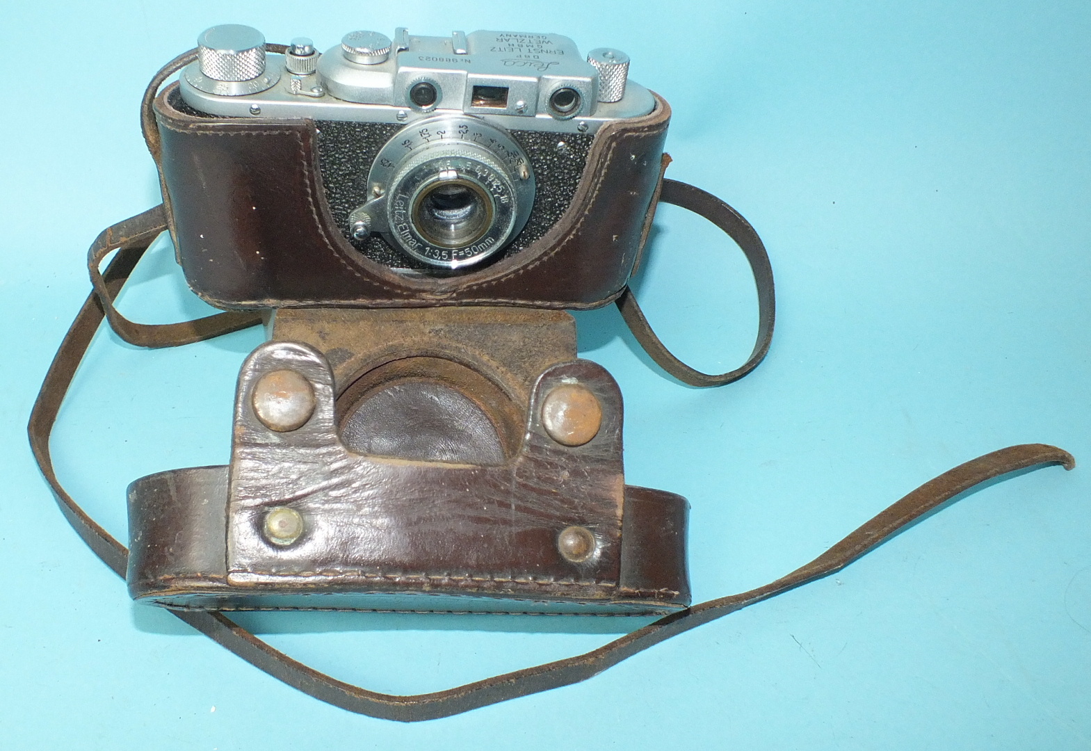 A Russian copy of a Leica II camera and four wooden "Leica" display stands. - Image 2 of 7