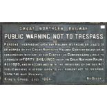 A late-19th century cast iron railway sign, painted white on black, "Great Northern Railway.