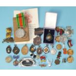 A quantity of commemorative medallions, a WWII Defence Medal, race medals, a 'For Loyal Service'