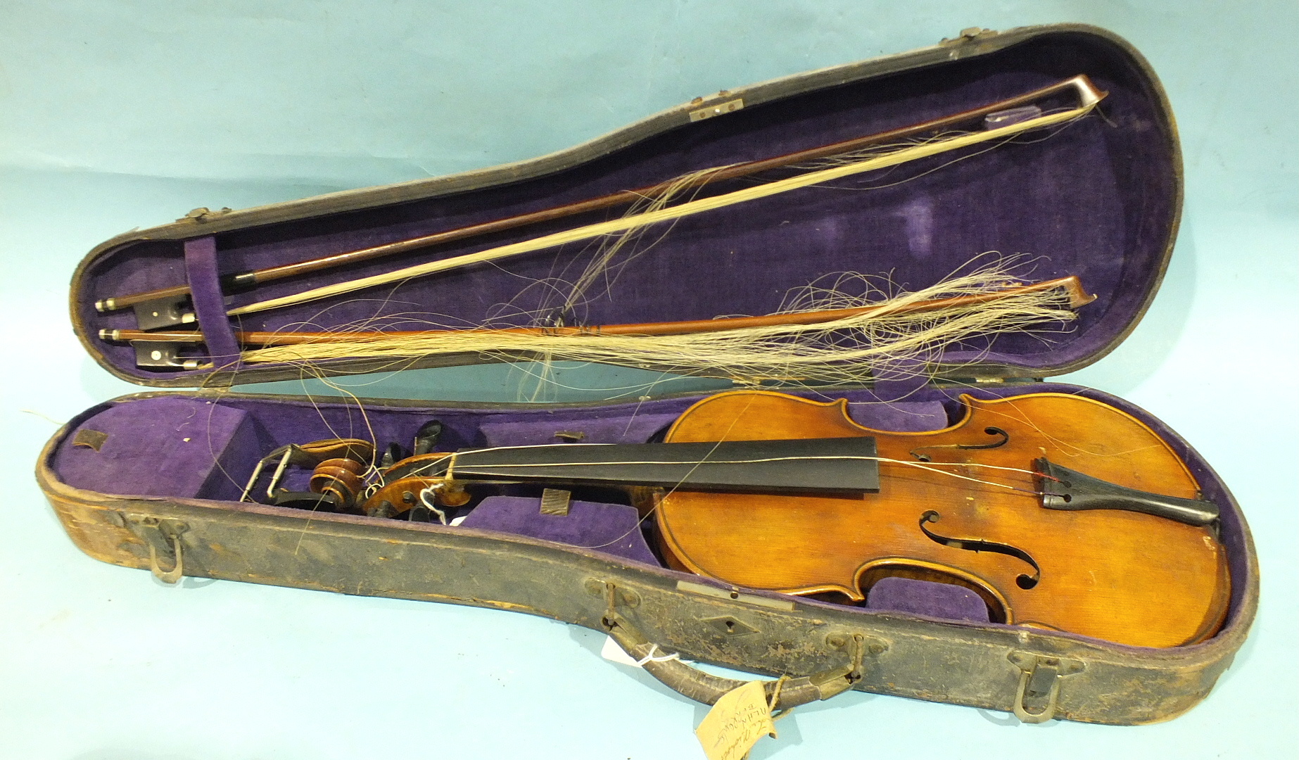 A Continental full-sized violin, with two-piece back and mother-of-pearl-inlaid ebony pegs,