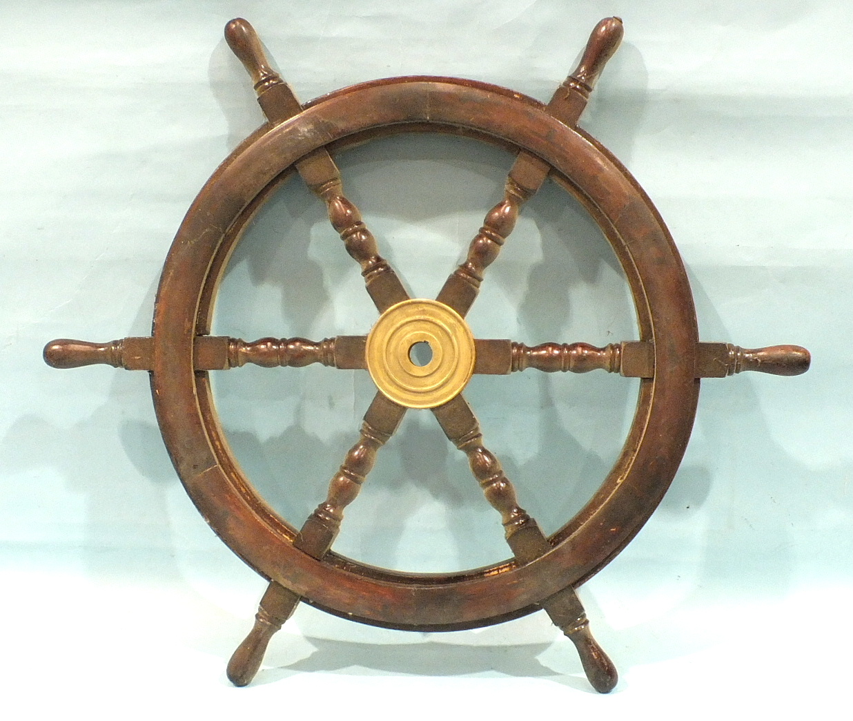 A six-spoke ship's wheel, 76cm diameter.