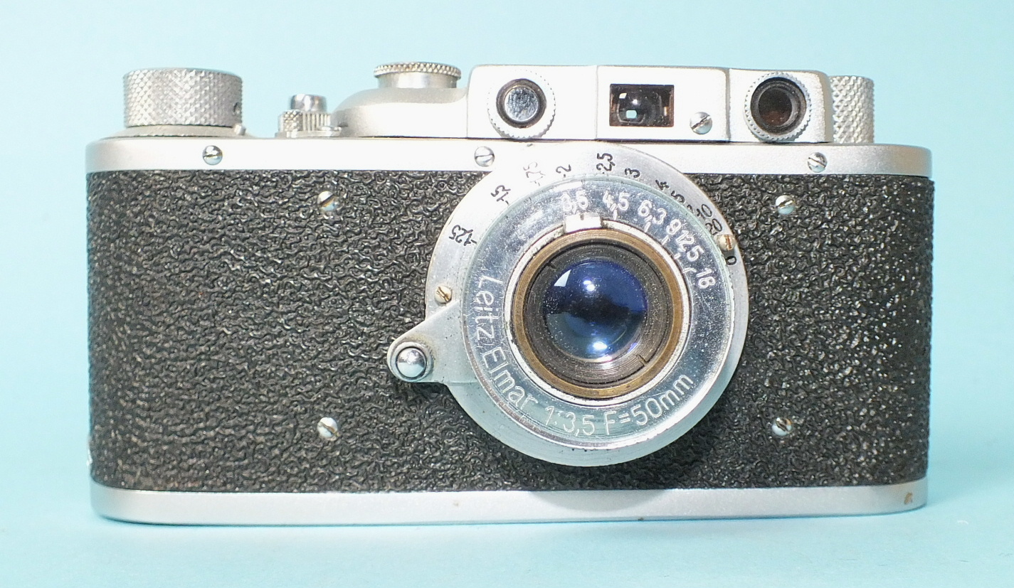 A Russian copy of a Leica II camera and four wooden "Leica" display stands. - Image 3 of 7