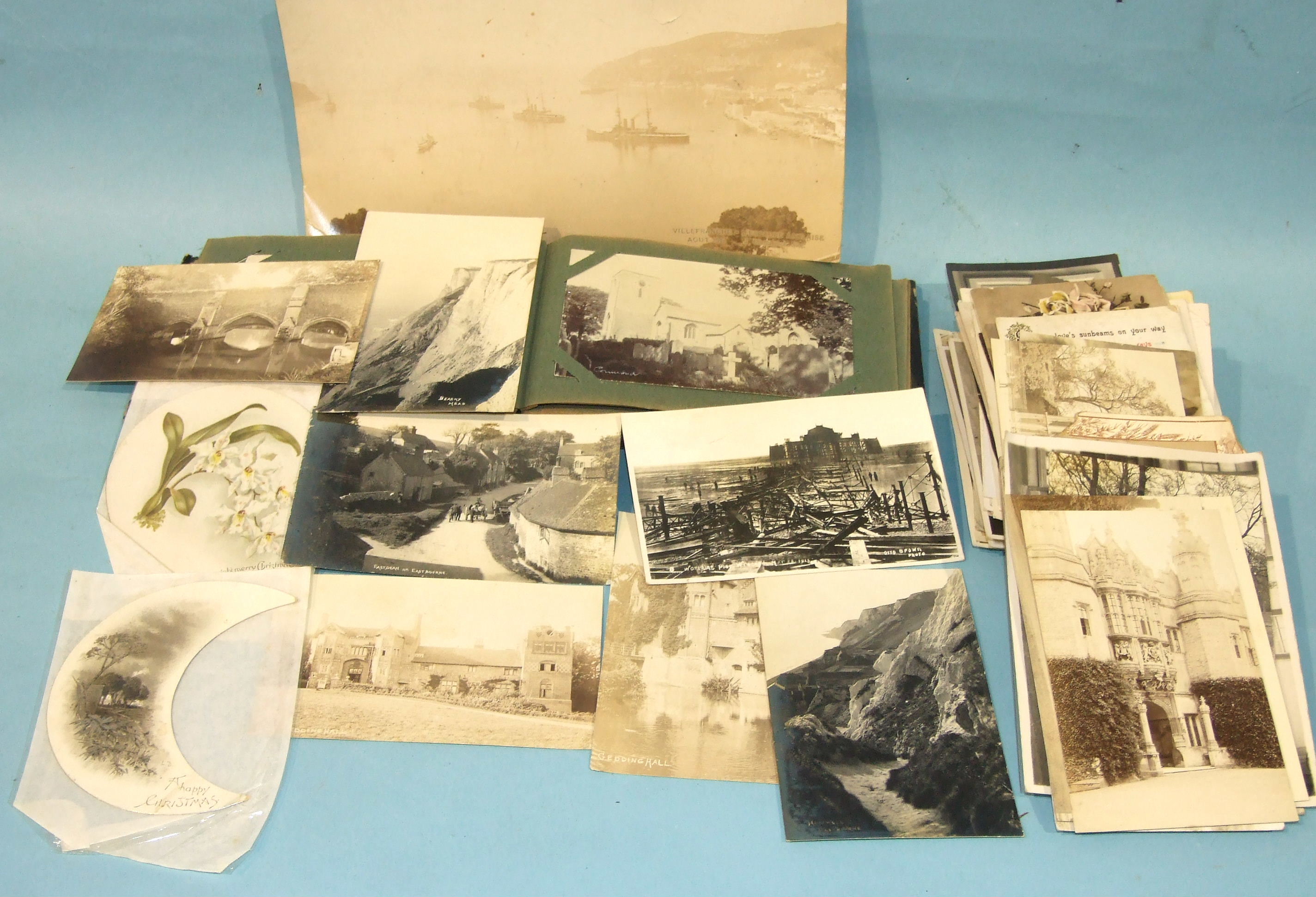 Approximately 85 postcards of Plymouth in two albums and other postcards, including humour