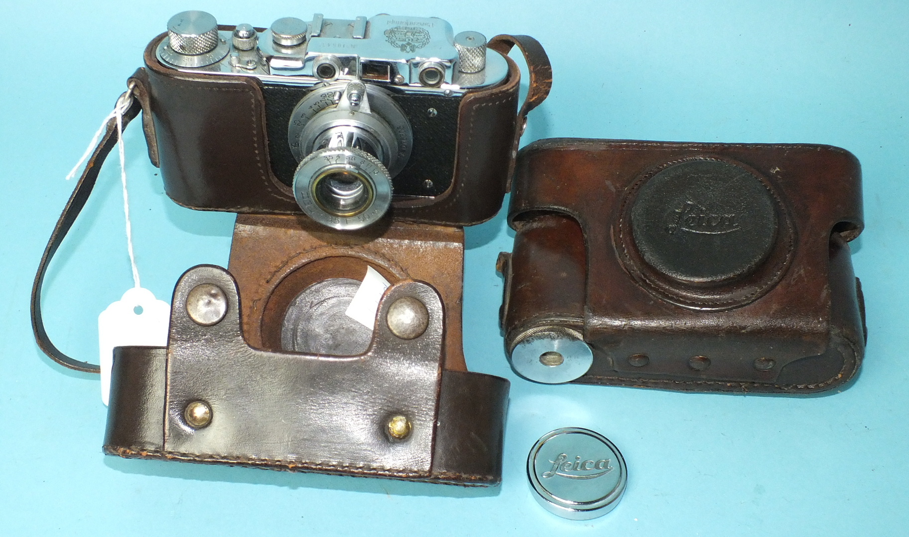 A Russian copy of a Leica II camera with "Panzerkampf" insignia, numbered 10543, in leather case and