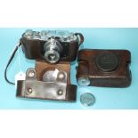 A Russian copy of a Leica II camera with "Panzerkampf" insignia, numbered 10543, in leather case and
