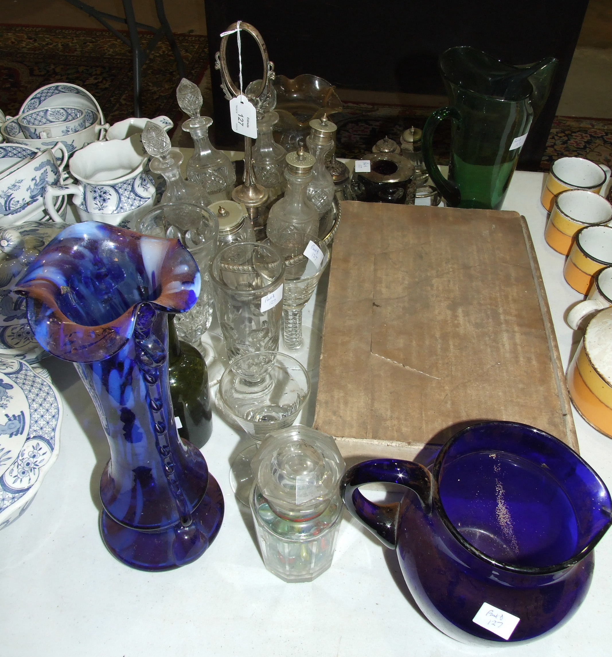 A plated revolving six-bottle cruet stand and a small quantity of glassware.