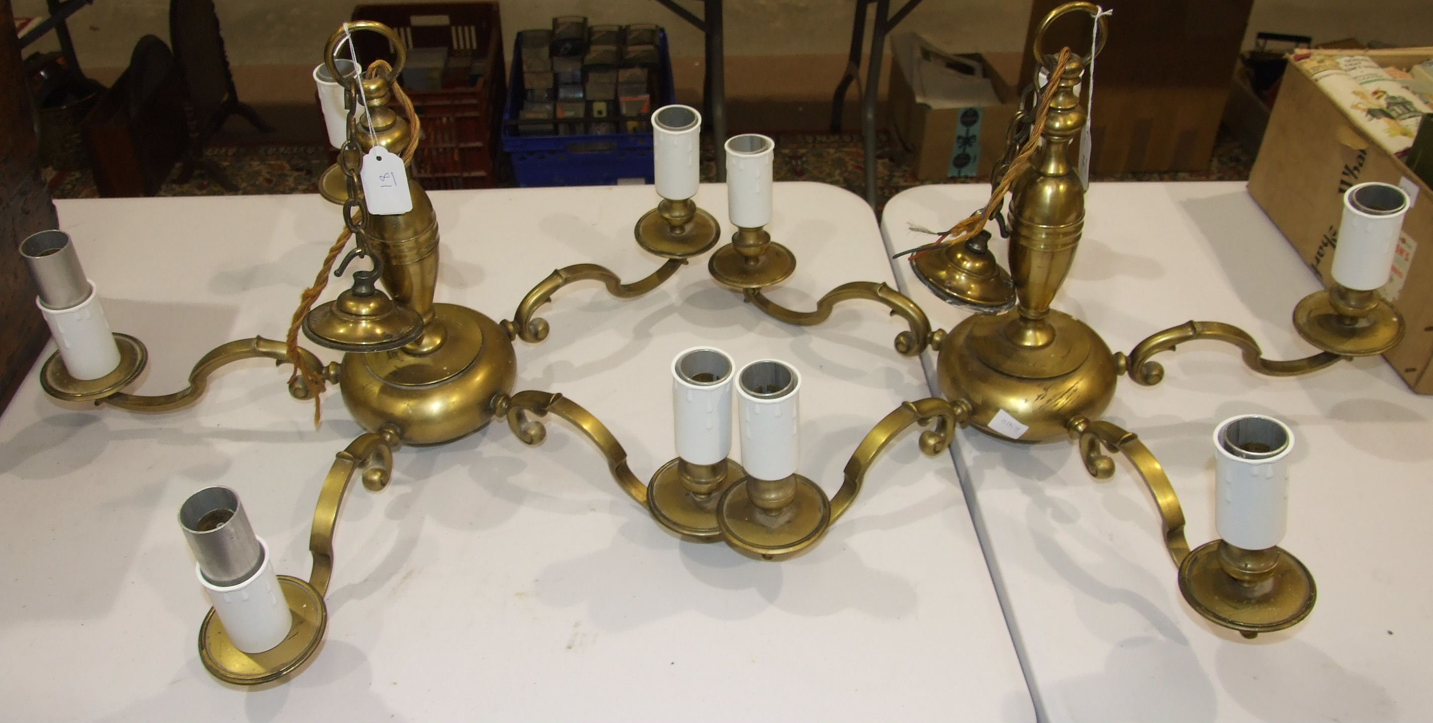 A pair of brass four-branch chandeliers, 61cm diameter, 38cm high.