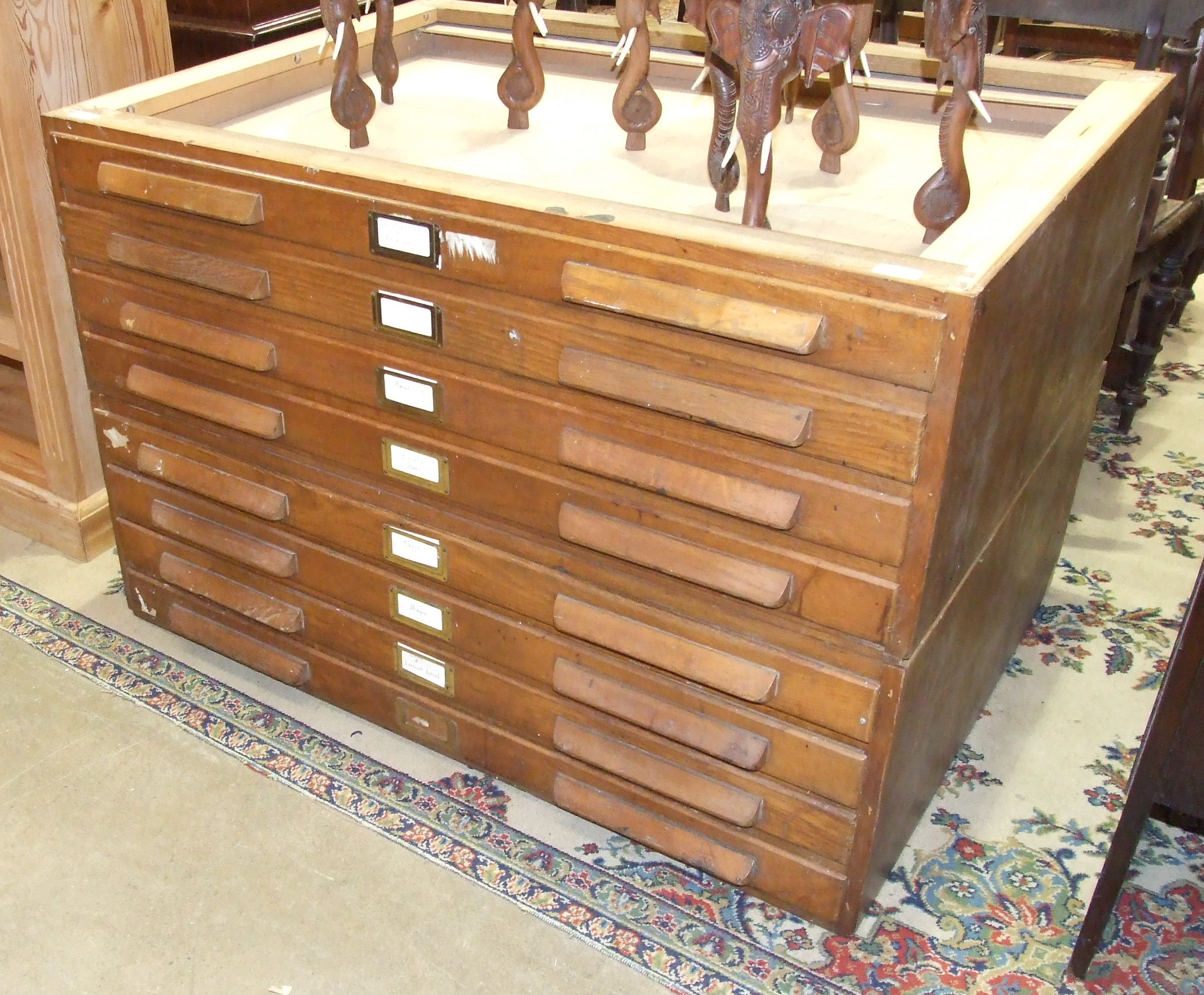 An oak two-part plan chest, 115cm wide, 76cm high, (top lacking).
