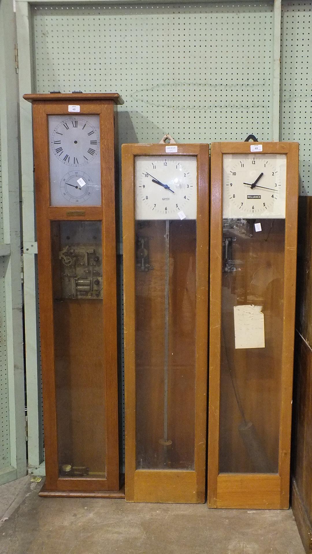 A Gents electric master clock, 168cm high, a similar electric master clock with 'Reliance' on