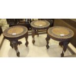 Three carved hardwood occasional tables with carved elephant mask legs, (3).