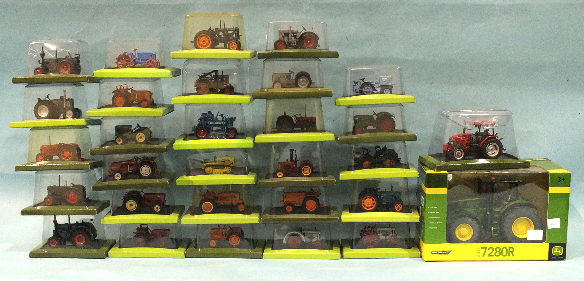 A collection of twenty-nine boxed diecast tractors by Hachette Partworks, a Britains 42713 diecast