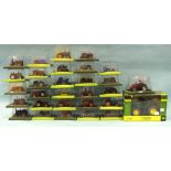 A collection of twenty-nine boxed diecast tractors by Hachette Partworks, a Britains 42713 diecast