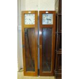 Two Gents electric master clocks, both 128cm high, (a/f), with pendulums.