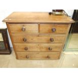 A pitch pine straight-front chest of two short and three long drawers, 106cm wide, (legs lacking).