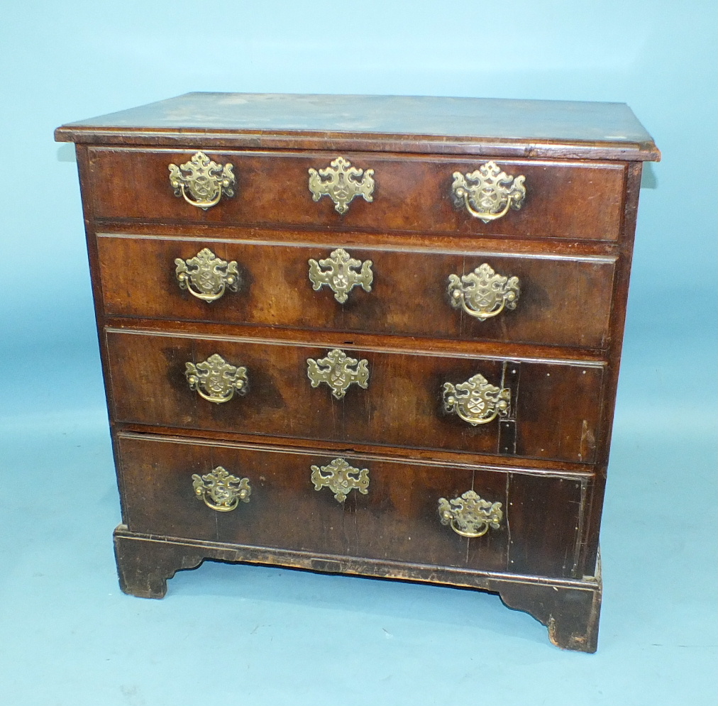 An early-18th century mahogany small chest of four long drawers, on bracket feet, 83cm wide, 79cm