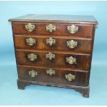 An early-18th century mahogany small chest of four long drawers, on bracket feet, 83cm wide, 79cm