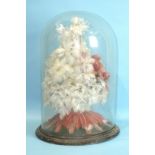 A Victorian display of feathers in the form of flowers and an exotic bird 40cm high, within a