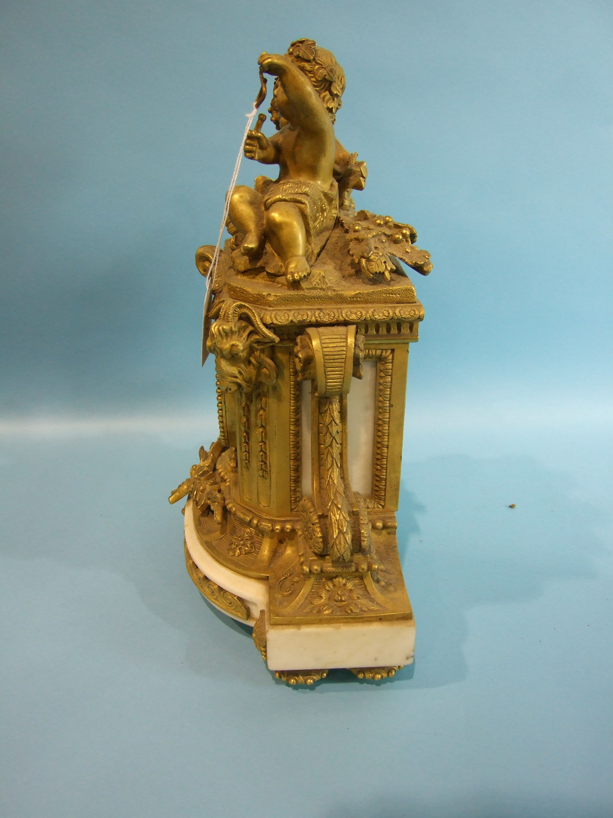 A 19th century French ormolu and alabaster mantel clock, the arched case surmounted by two - Image 2 of 4