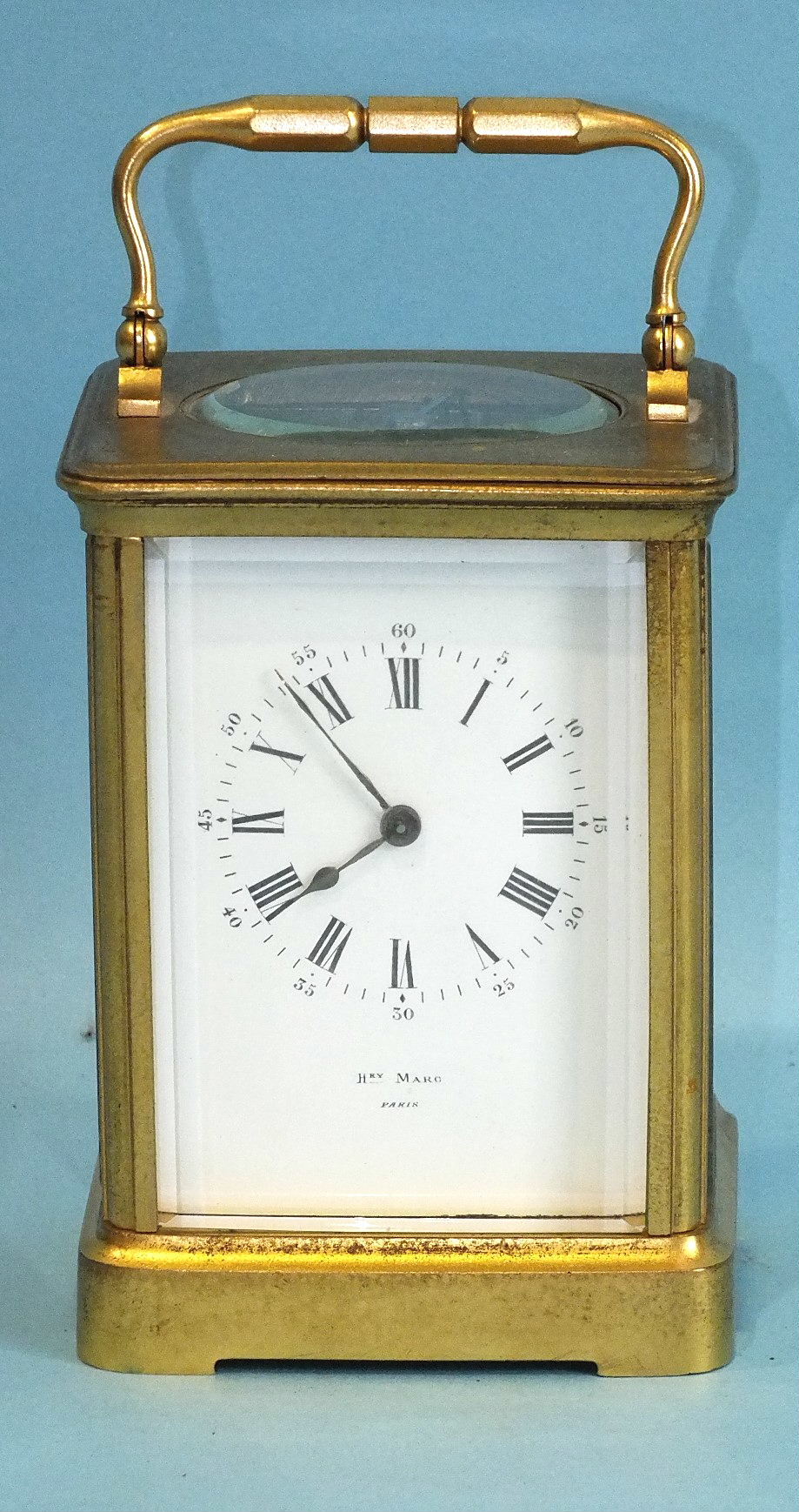A 19th century gilt brass carriage clock, the white enamel dial signed Hry Marc, Paris, with typical