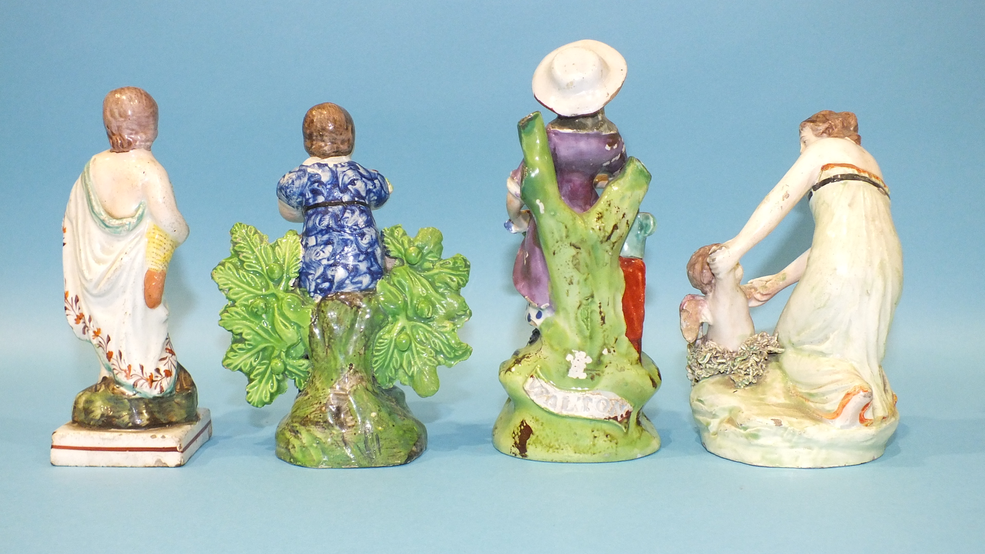 Four 19th century Staffordshire pearlware small figures, three representing children in rural - Image 2 of 3