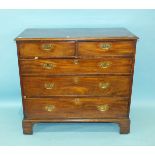 A Georgian mahogany rectangular chest, the top with moulded edge above two small and three long