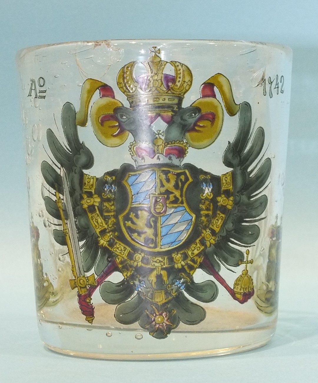 A 19th century German enamelled glass beaker commemorating the Treaty of Berlin, dated 1742, (chip